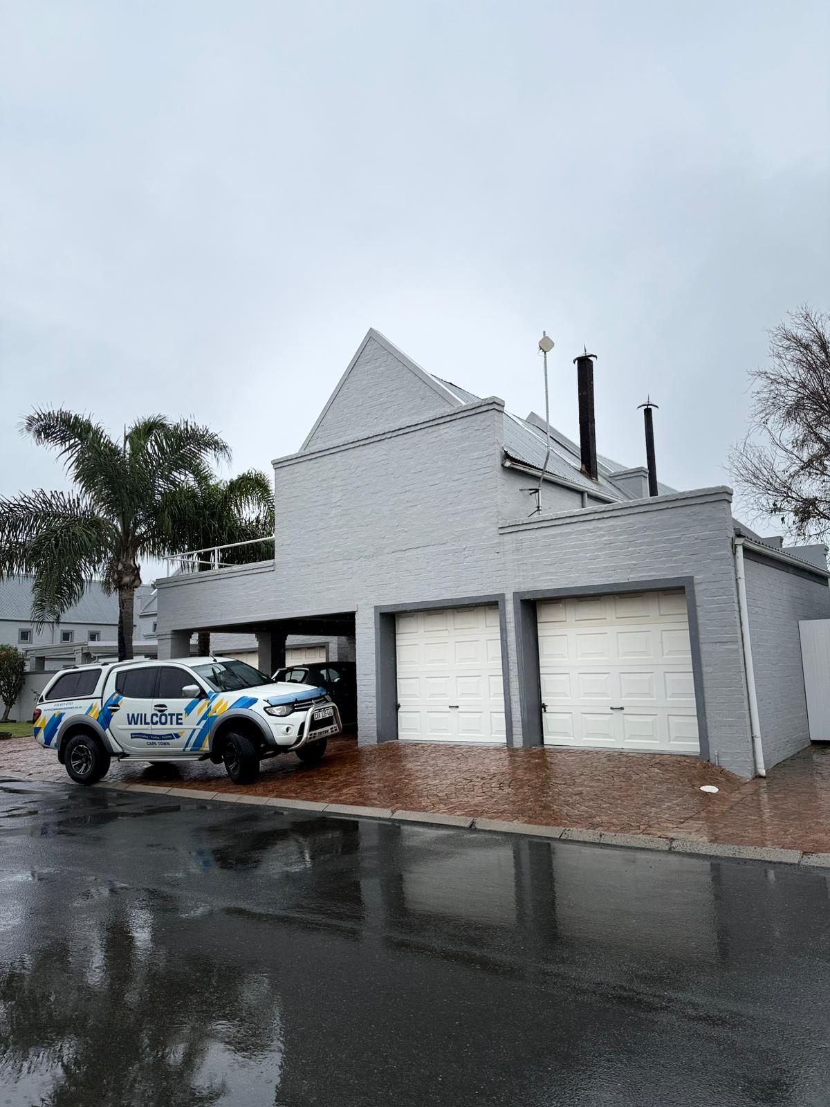 waterproofing roof painting in Cape Town" "flat roof being waterproofed and painted