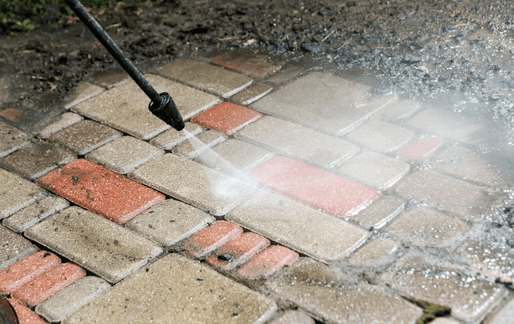 High-pressure cleaning of a stained driveway in Durbanville, Cape Town