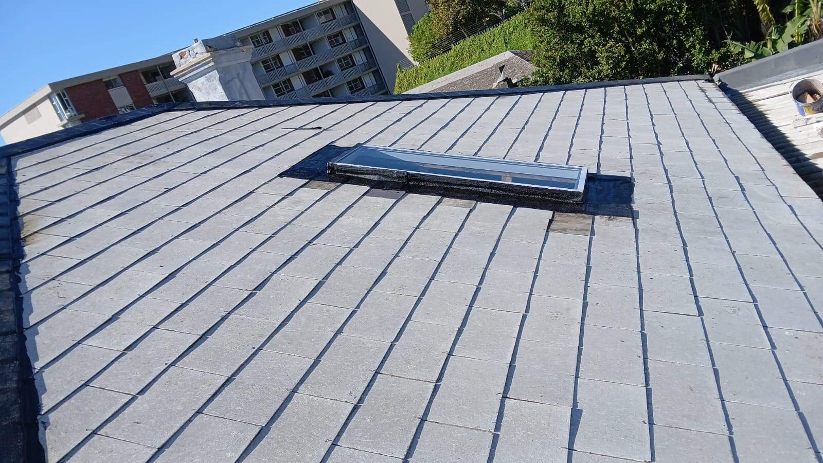 Torch-on waterproofing applied around skylight on Green Point roof by Wilcote Cape Town.