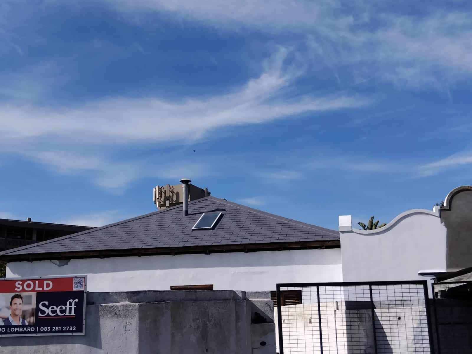 Completed roof painting in Green Point with UV-resistant coating by Wilcote Cape Town.